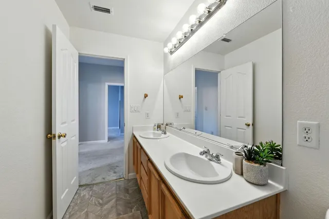 a view of a porch with furniture and a backyard