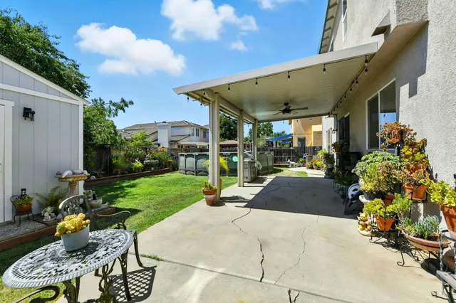 a view of a chair and tables in the patio