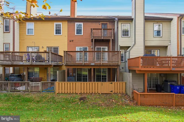 a view of a yard with a house in the background