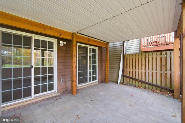 a picture of a room with a white wall and car