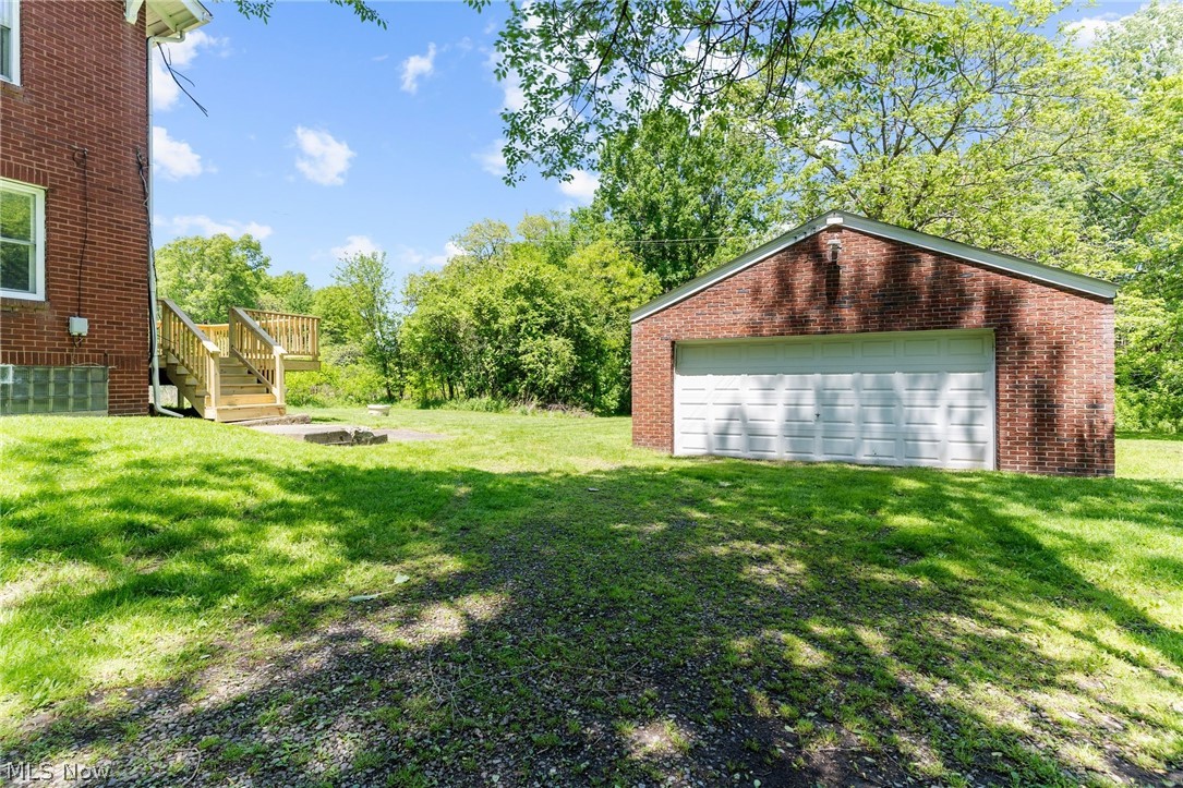4646 Kirk Road Youngstown, OH 44515 - Photo 3 of 18 View of yard featuring a garage and an outdoor structure