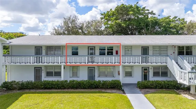 a front view of a house with swimming pool