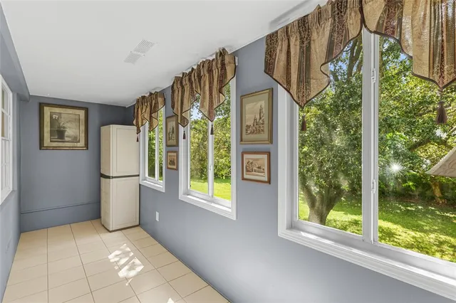 a view of porch with furniture and garden