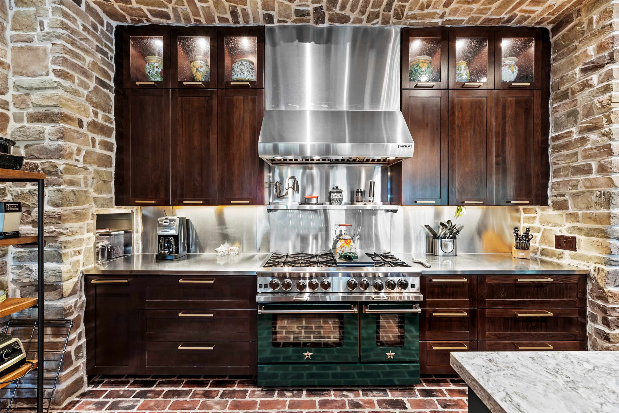 7715 Firethorne Creek Court Spring, TX 77389 - Photo 17 of 50 a kitchen with a stove and cabinets