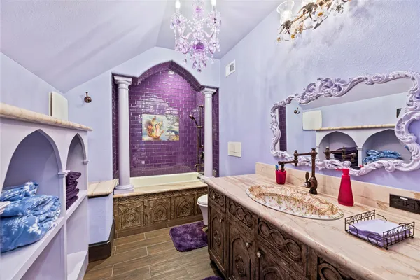 a spacious bathroom with a sink double vanity granite and shower
