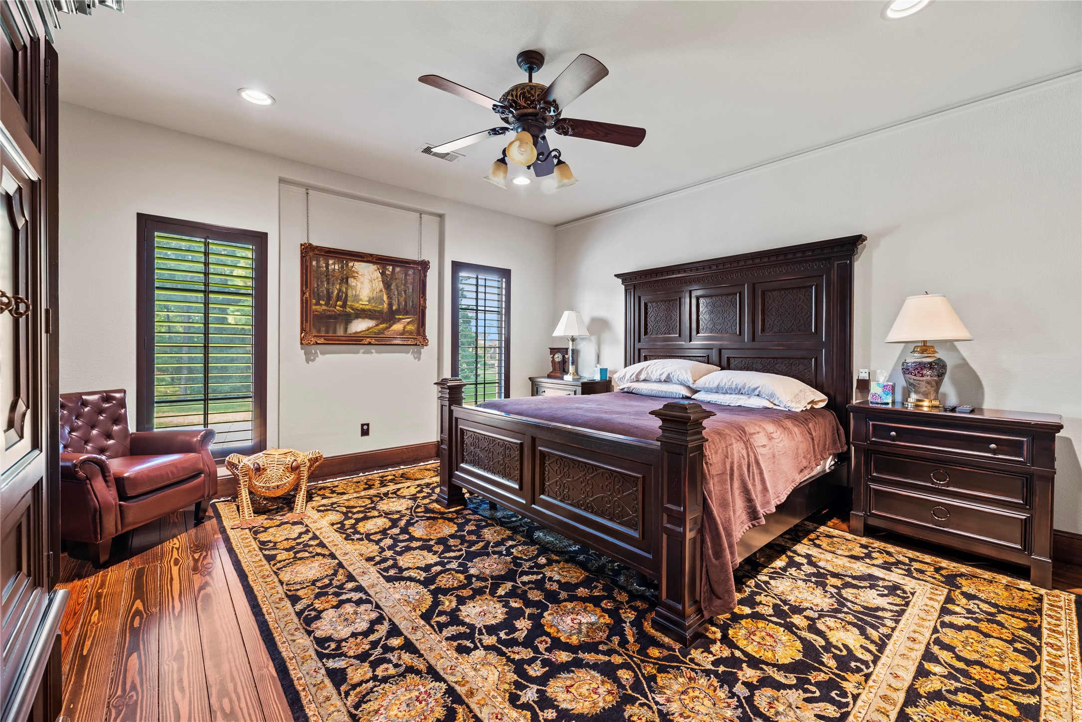 7715 Firethorne Creek Court Spring, TX 77389 - Photo 34 of 50 a bedroom with a bed and wooden floor