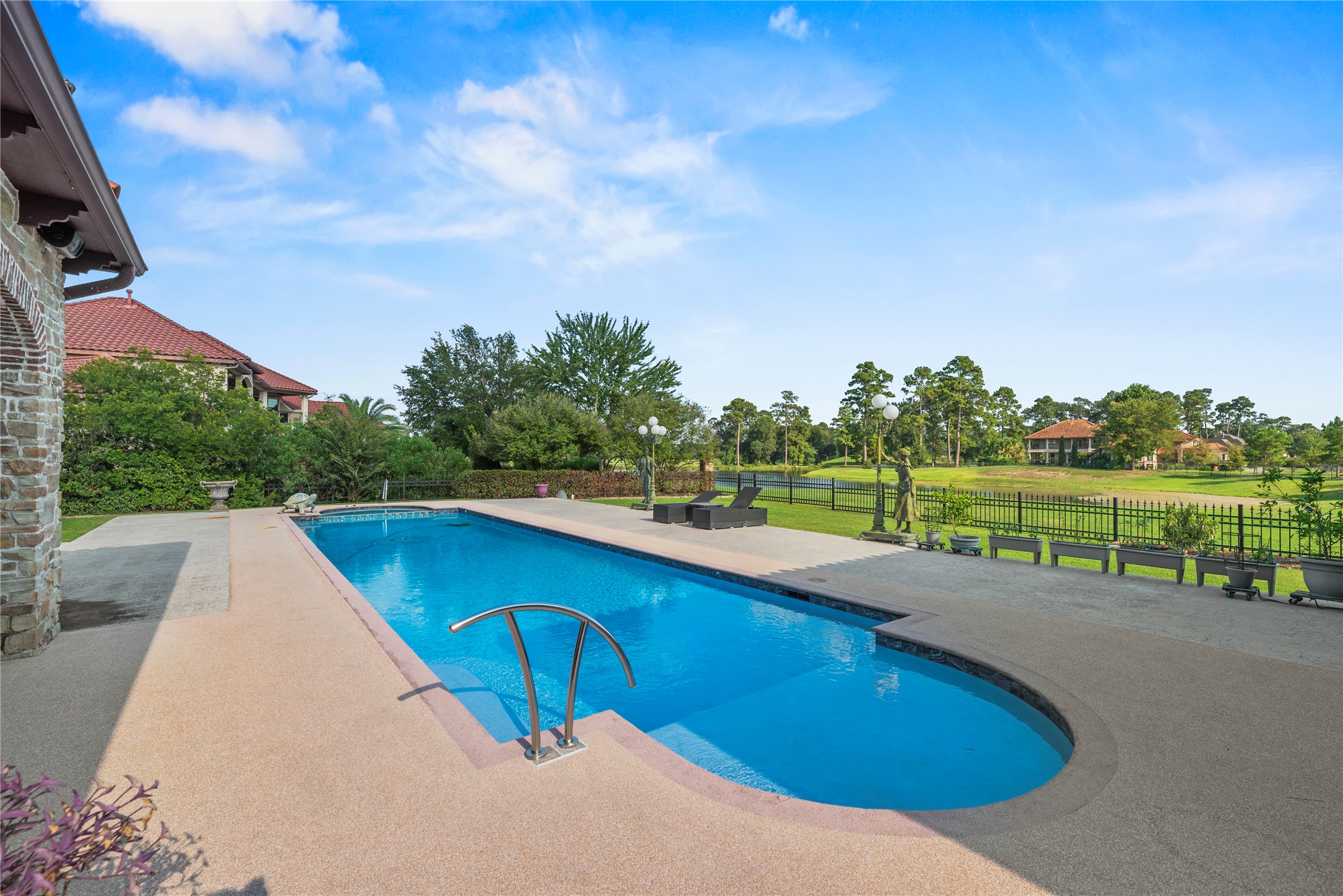 7715 Firethorne Creek Court Spring, TX 77389 - Photo 42 of 50 a view of swimming pool with a yard and sitting area