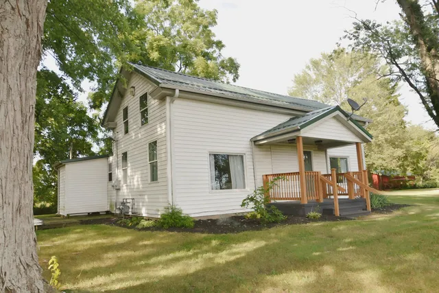 a bed room with a bed and a lamp