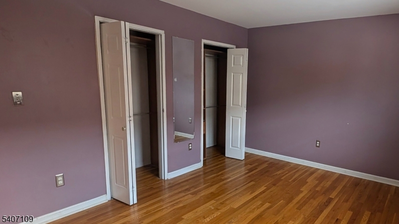2467 Highway 10, Unit 3B Morris Plains, NJ 07950 - Photo 13 of 22 an empty room with wooden floor and closet