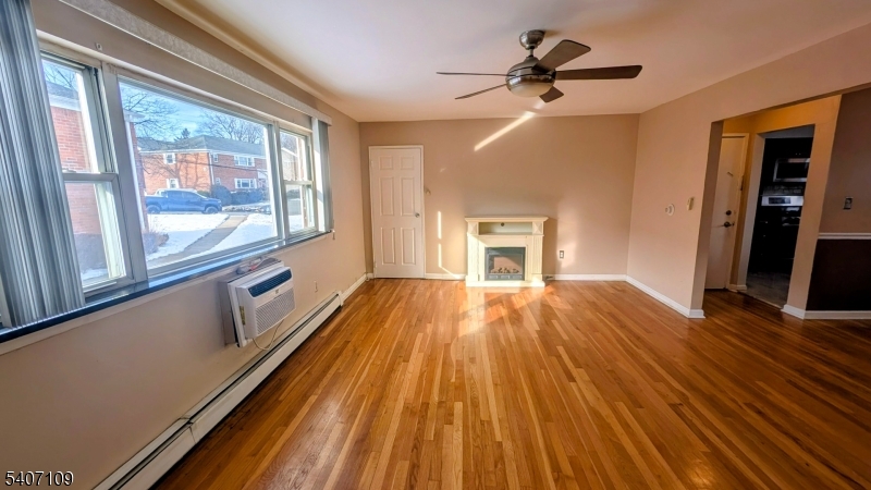 2467 Highway 10, Unit 3B Morris Plains, NJ 07950 - Photo 4 of 22 a view of empty room with wooden floor and fan