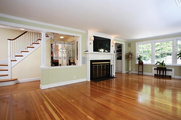 76 Denny Road Brookline, MA 02467 - Photo 2 of 11 a living room with furniture a fireplace and a flat screen tv