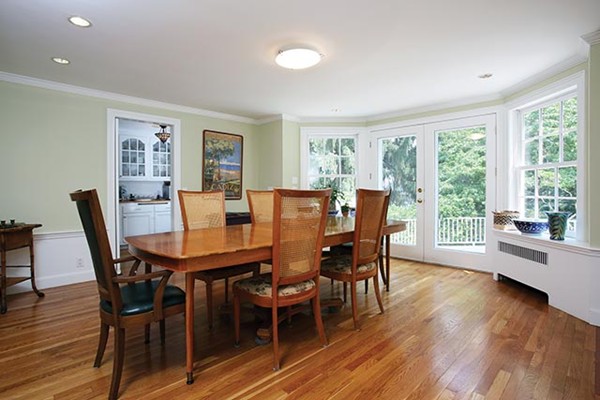 76 Denny Road Brookline, MA 02467 - Photo 3 of 11 a view of a dining room with furniture window and wooden floor