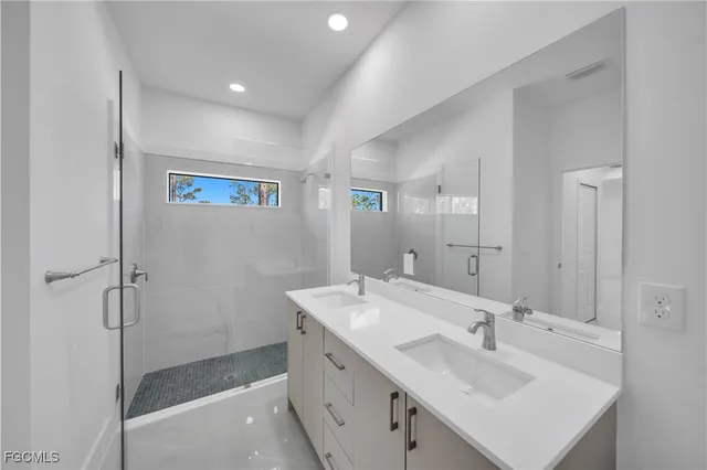 an empty room with closet and a chandelier fan