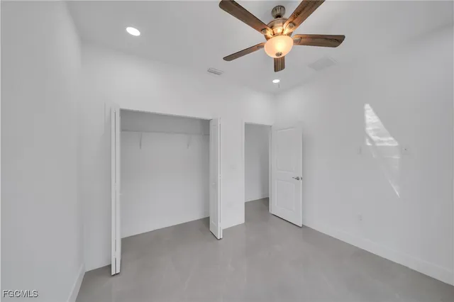a bathroom with a tub shower vanity and a sink