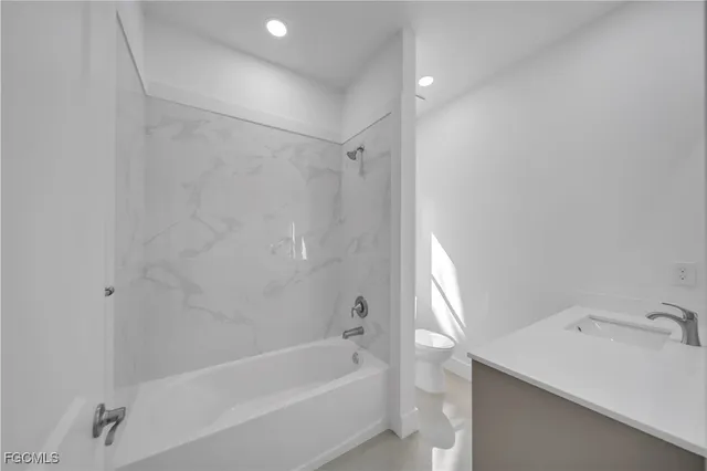 a utility room with a sink and a mirror