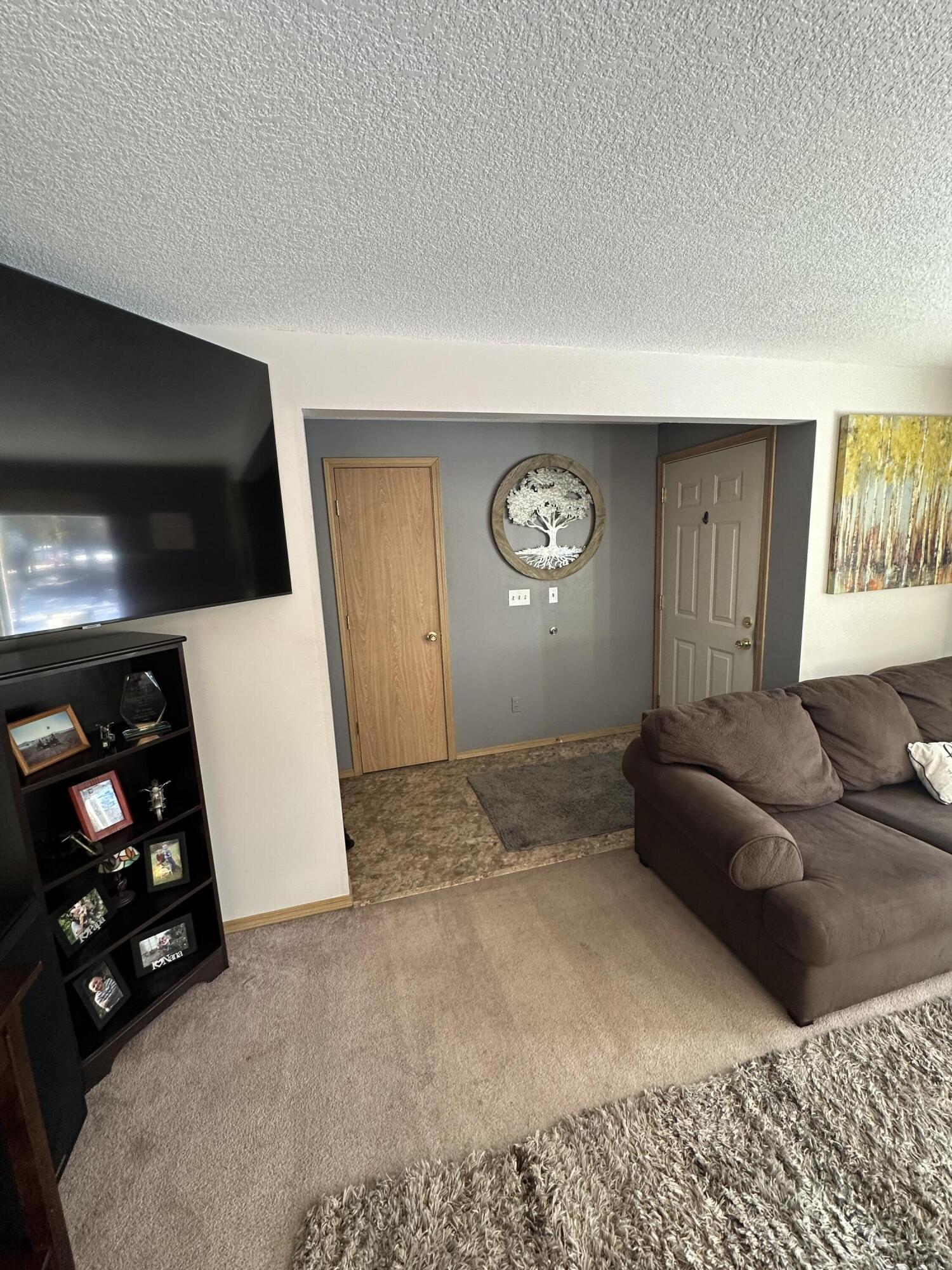 123977 Surveyor Road Crescent Lake, OR 97733 - Photo 15 of 41 a living room with furniture and a flat screen tv
