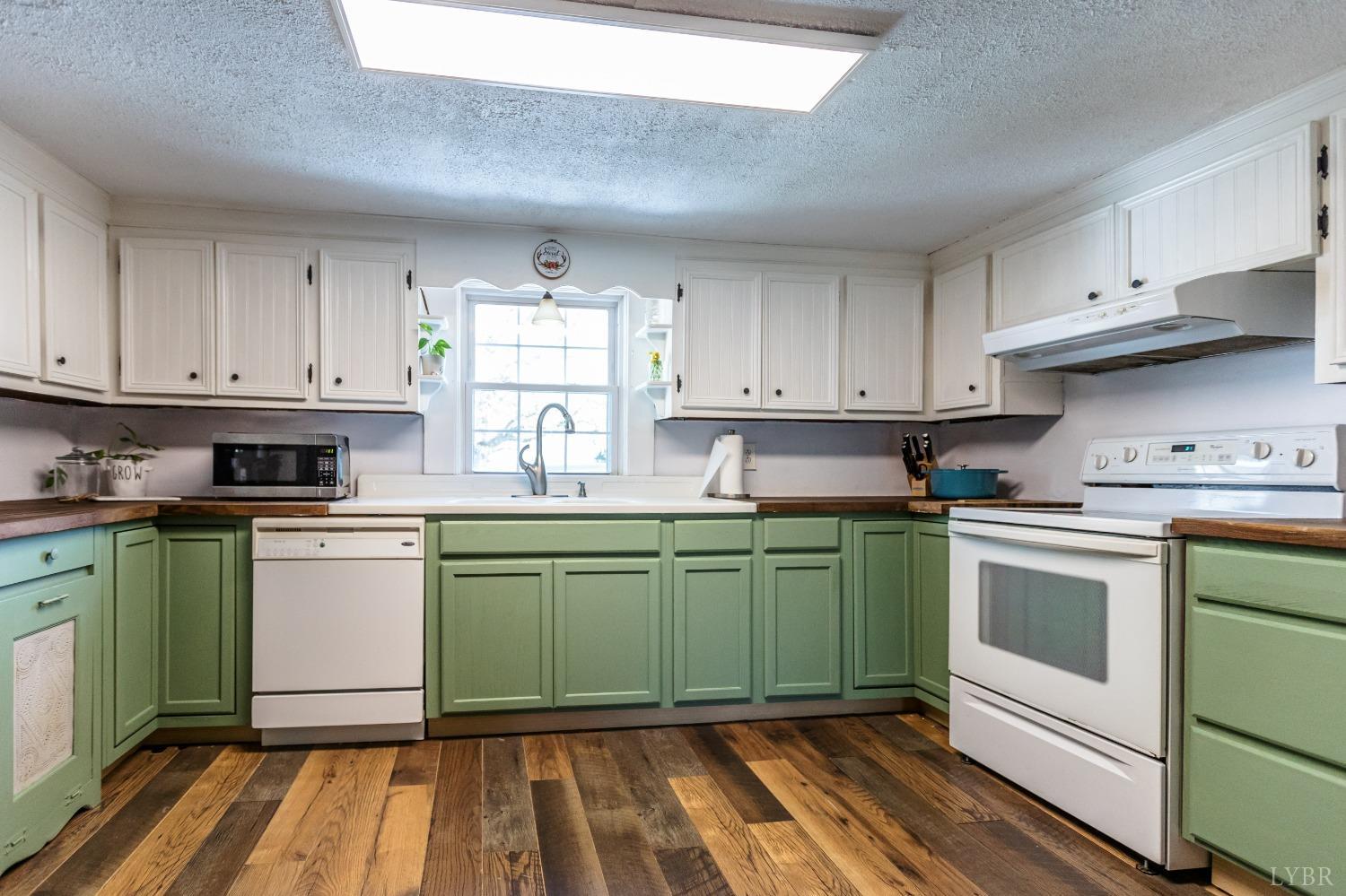 1564 Swan Road Pamplin, VA 23958 - Photo 17 of 60 a kitchen with a sink and cabinets