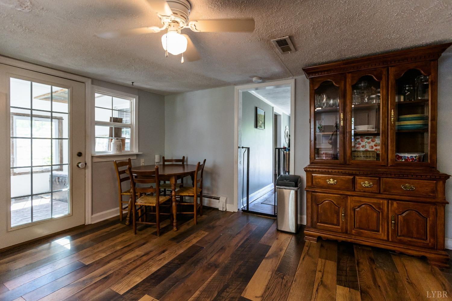 1564 Swan Road Pamplin, VA 23958 - Photo 19 of 60 a view of a dining room with furniture window and wooden floor