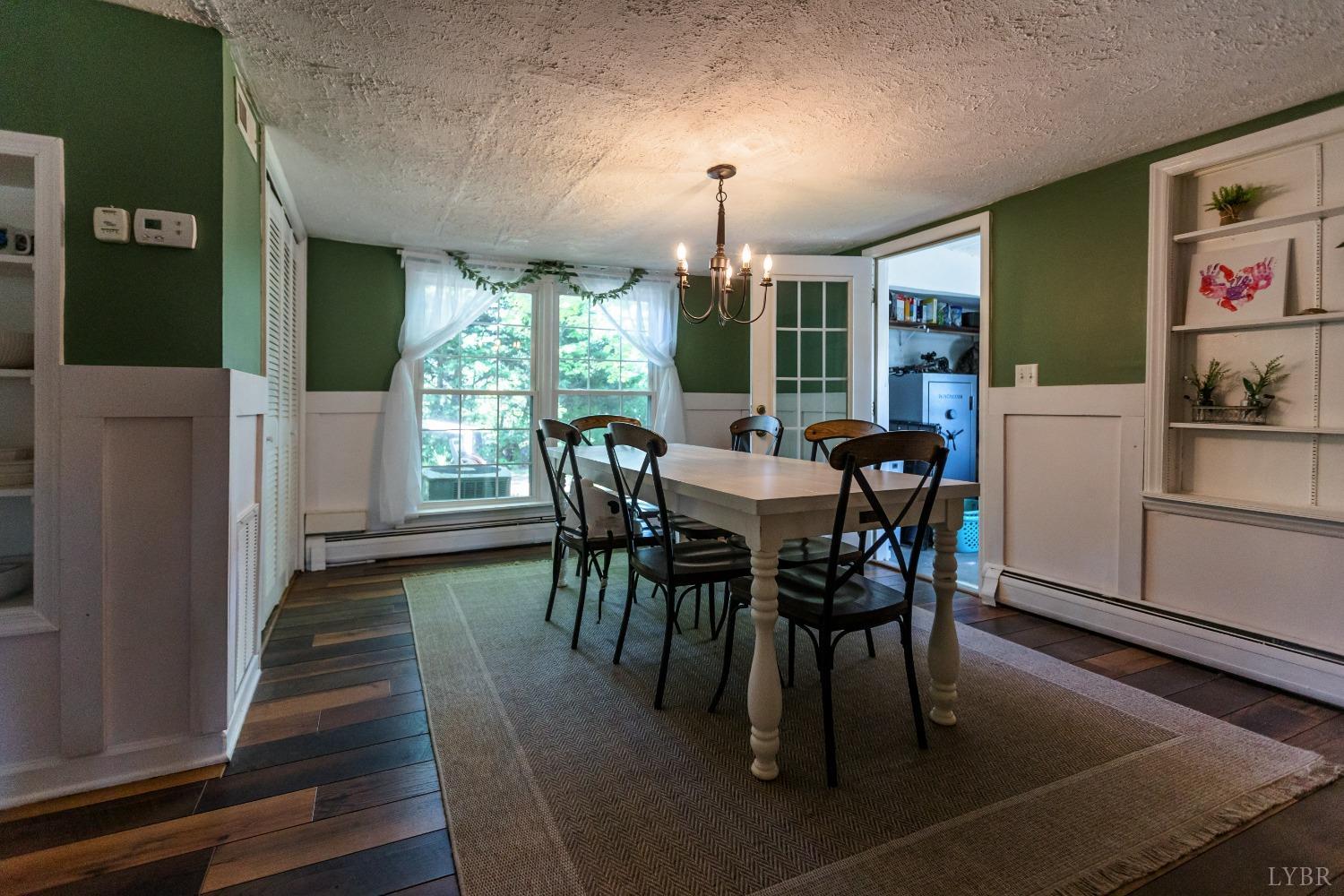 1564 Swan Road Pamplin, VA 23958 - Photo 20 of 60 a view of a dining room with furniture window and wooden floor