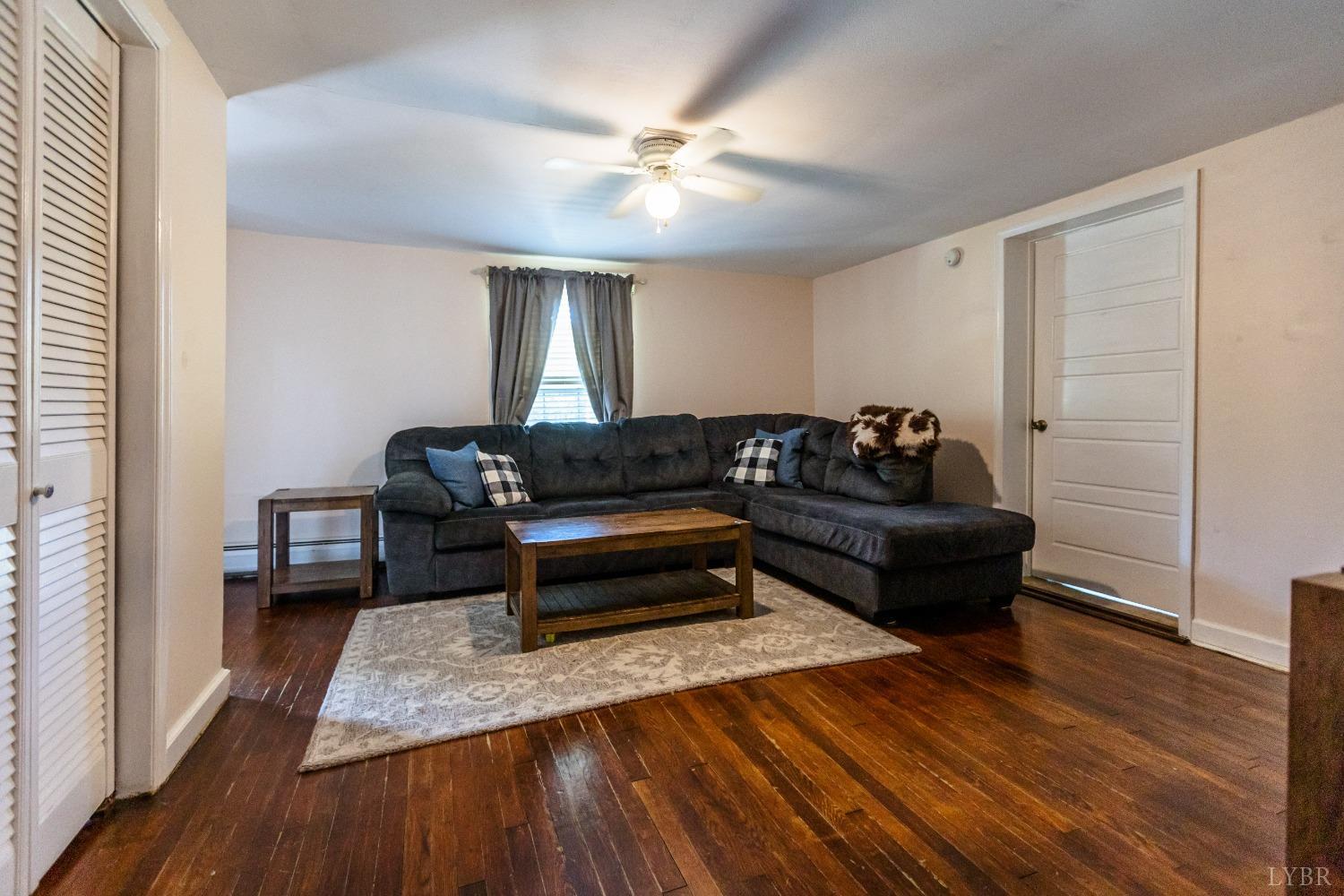 1564 Swan Road Pamplin, VA 23958 - Photo 23 of 60 a living room with furniture and a wooden floor