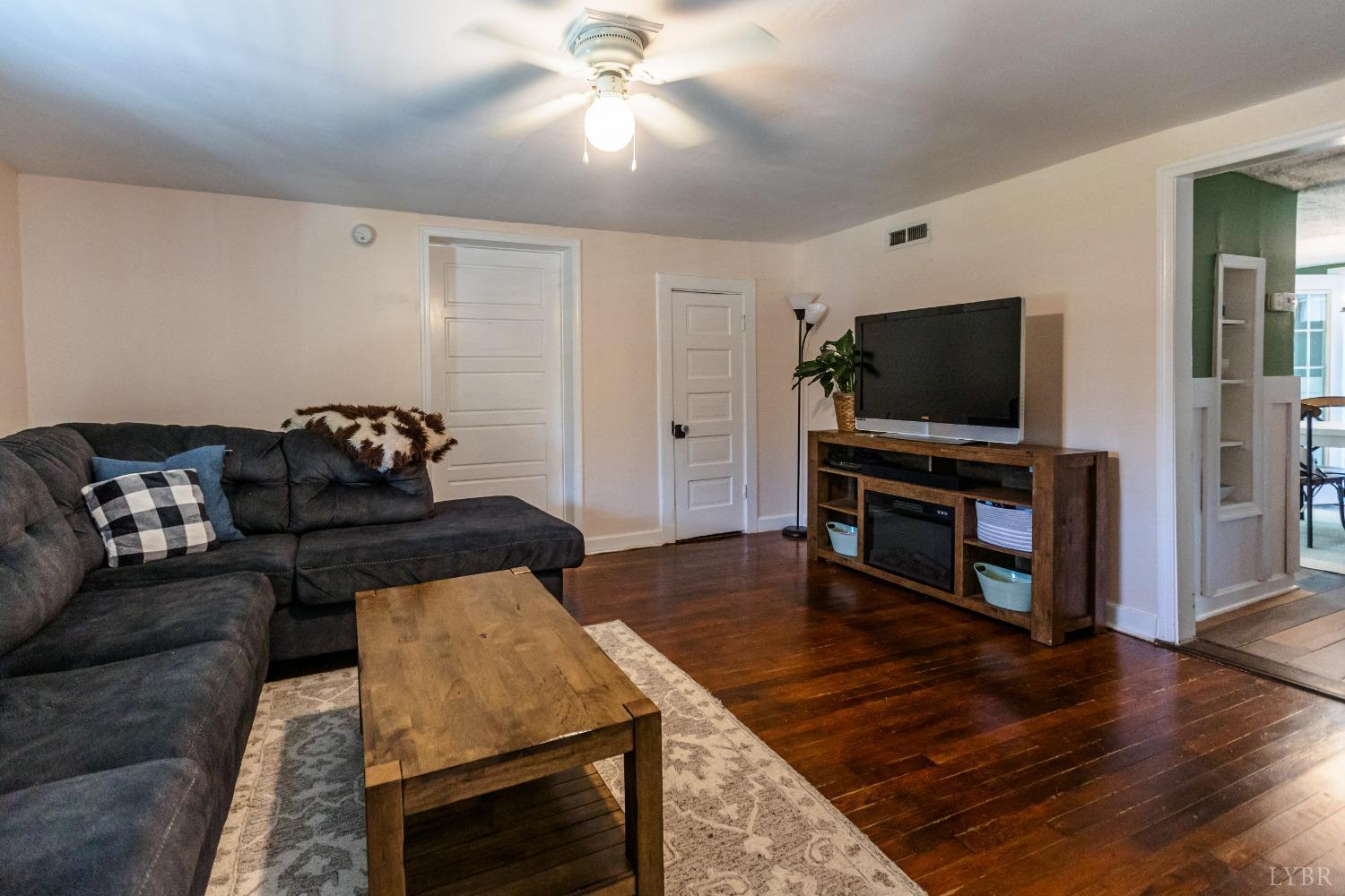 1564 Swan Road Pamplin, VA 23958 - Photo 24 of 60 a living room with furniture and a flat screen tv
