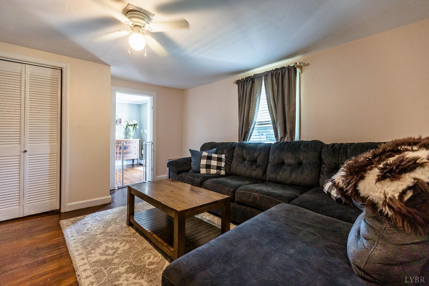1564 Swan Road Pamplin, VA 23958 - Photo 25 of 60 a living room with furniture and wooden floor