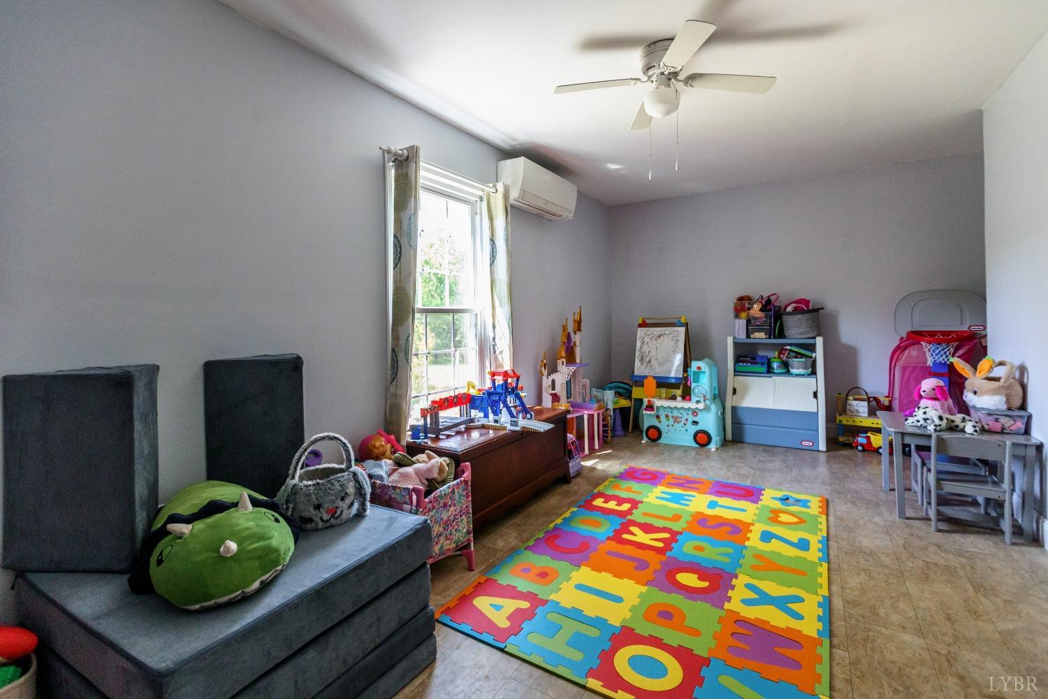 1564 Swan Road Pamplin, VA 23958 - Photo 26 of 60 a children room with toys and a couch