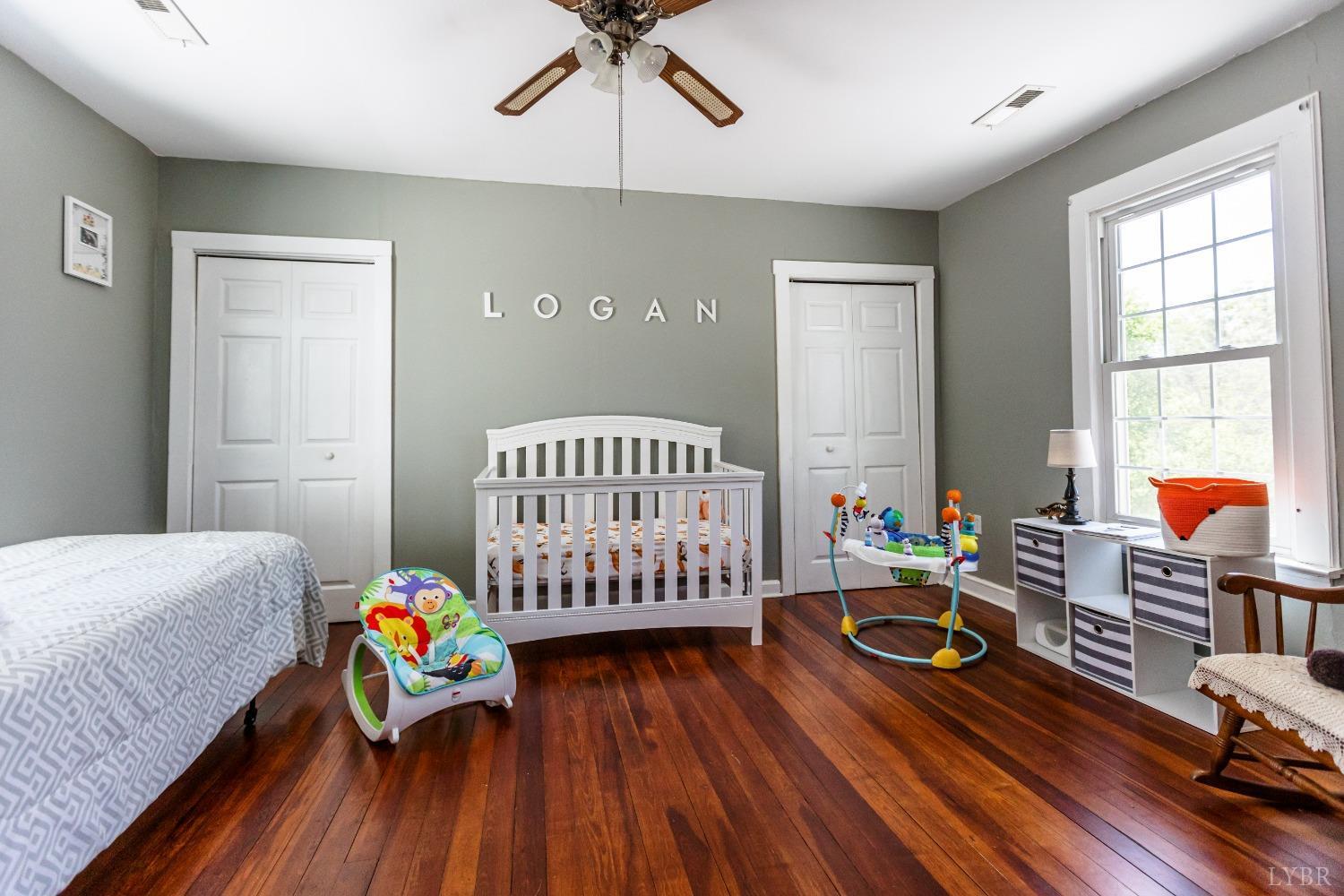 1564 Swan Road Pamplin, VA 23958 - Photo 31 of 60 a bedroom with furniture and wooden floor