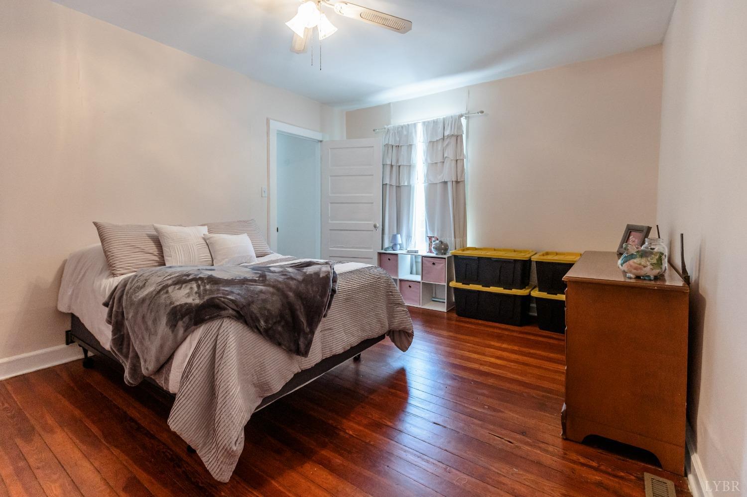 1564 Swan Road Pamplin, VA 23958 - Photo 33 of 60 a bedroom with a bed and wooden floor