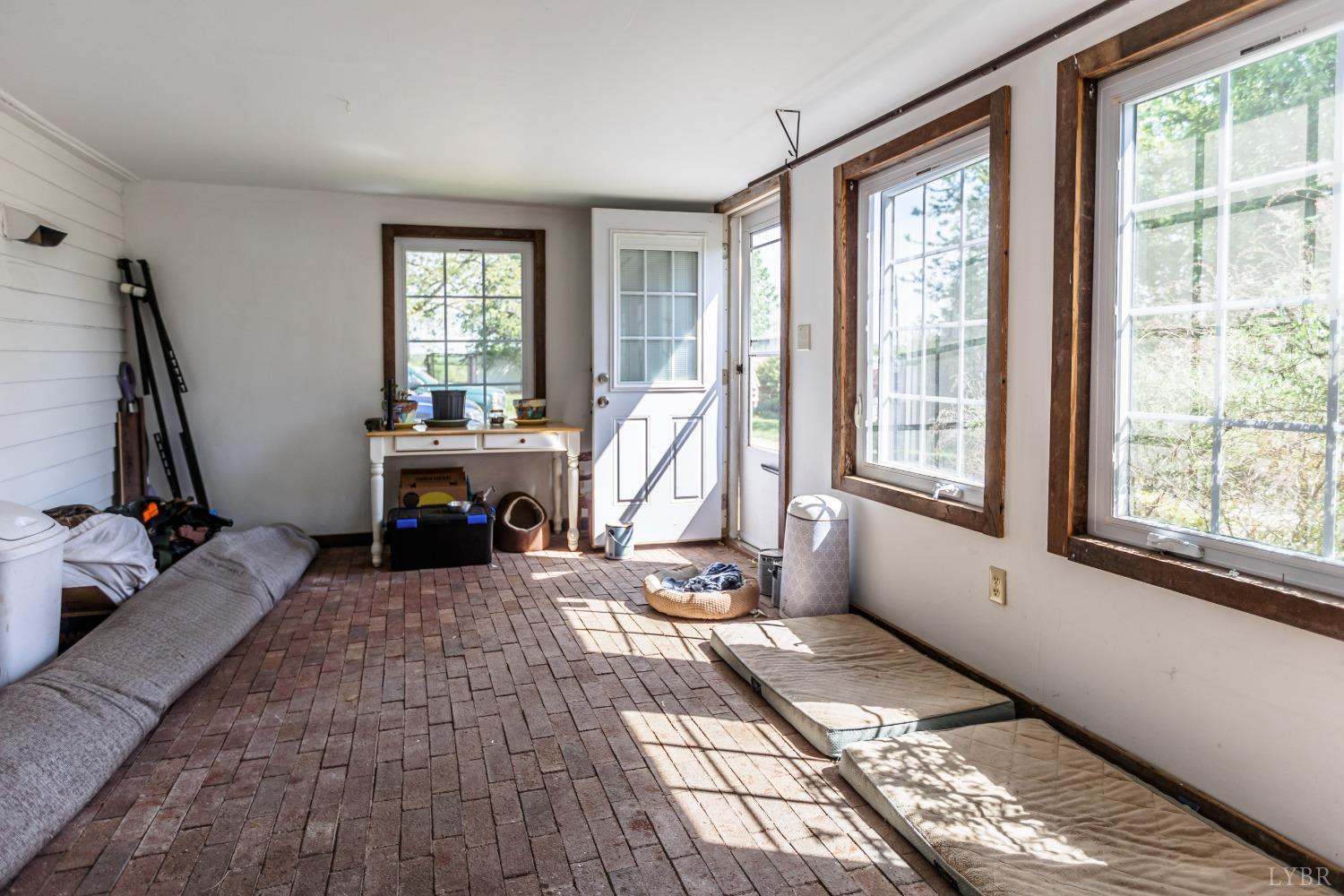 1564 Swan Road Pamplin, VA 23958 - Photo 41 of 60 a view of a room with gym equipment and windows