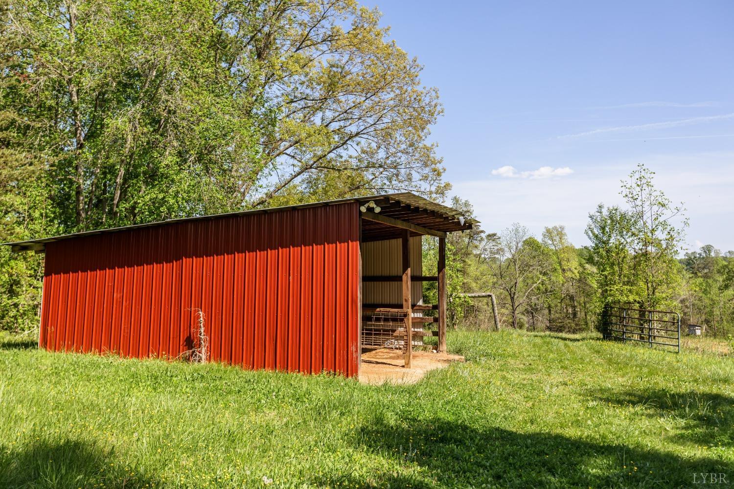 1564 Swan Road Pamplin, VA 23958 - Photo 58 of 60 a view of backyard with a barn and a cactus plant