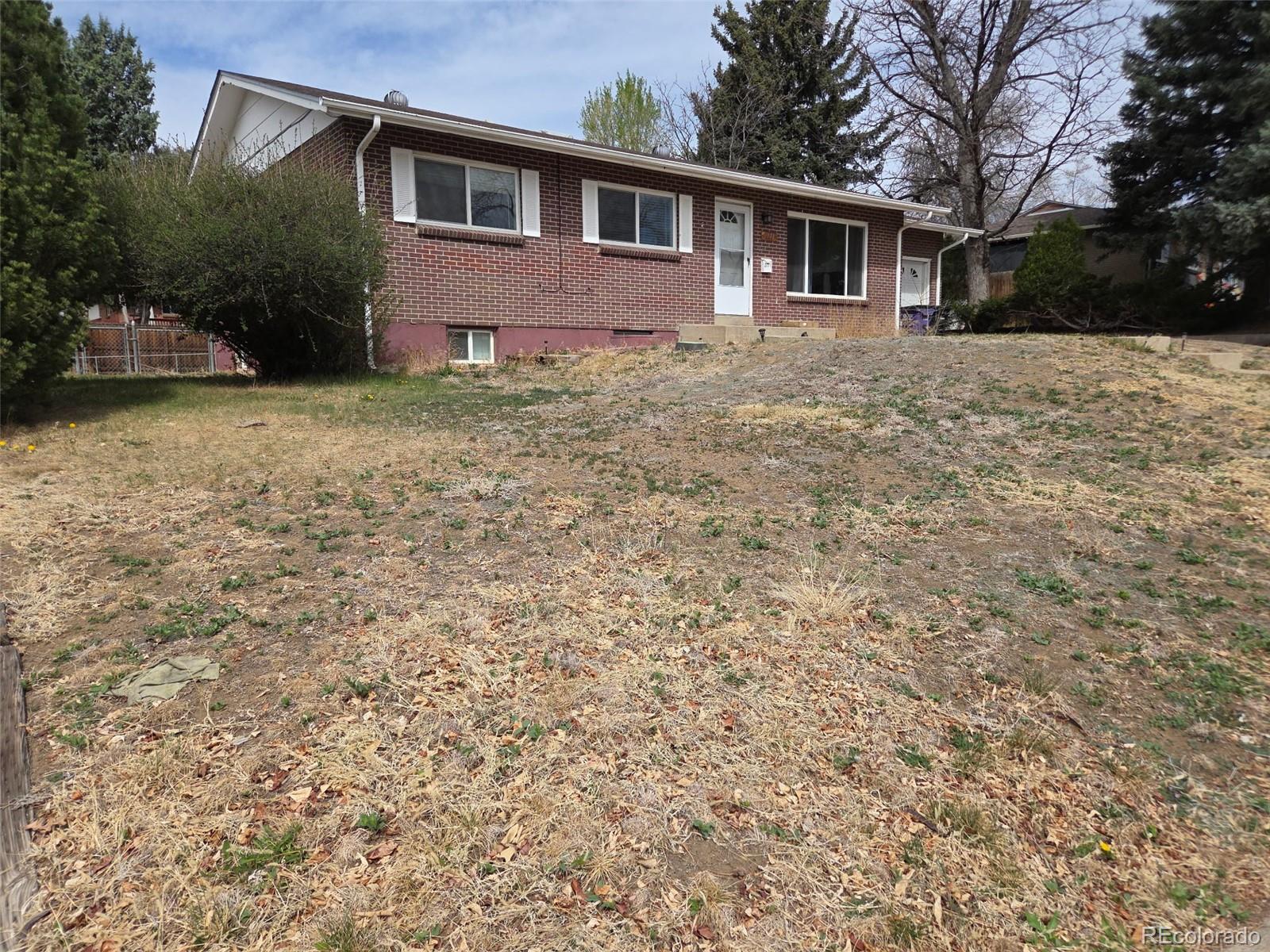 a front view of a house with yard