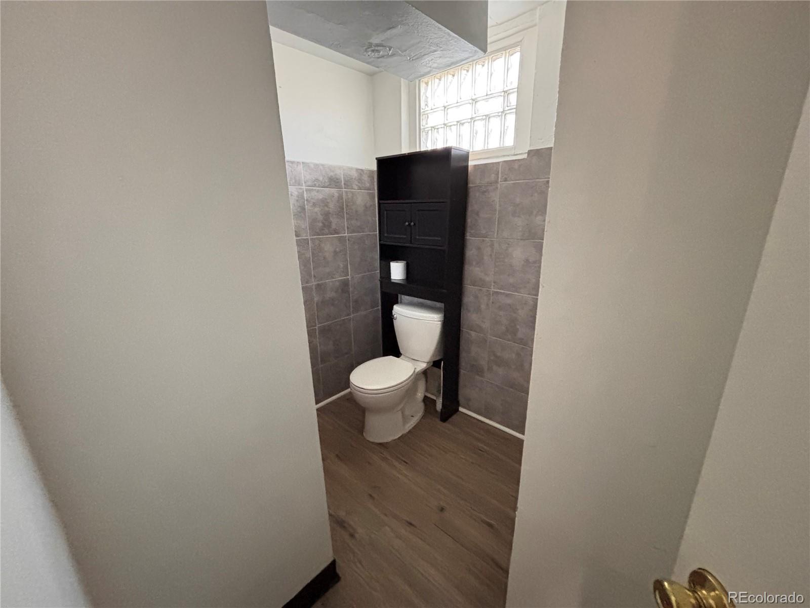 2771 South Perry Street Denver, CO 80236 - Photo 25 of 40 a bathroom with a toilet
