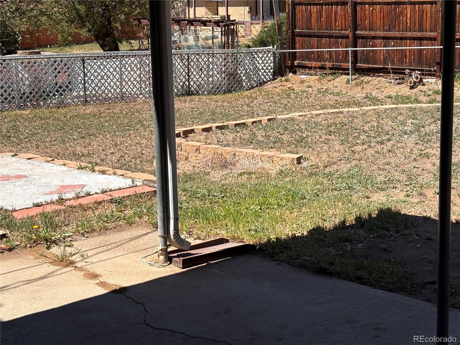 2771 South Perry Street Denver, CO 80236 - Photo 36 of 40 a view of a backyard of the house