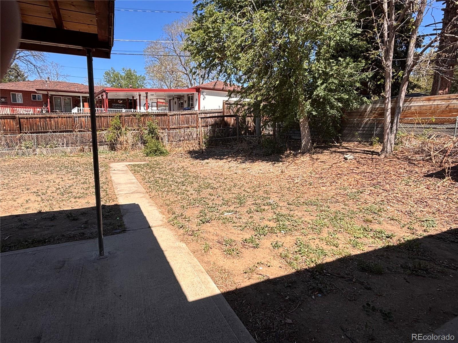 2771 South Perry Street Denver, CO 80236 - Photo 39 of 40 a view of a backyard of the house