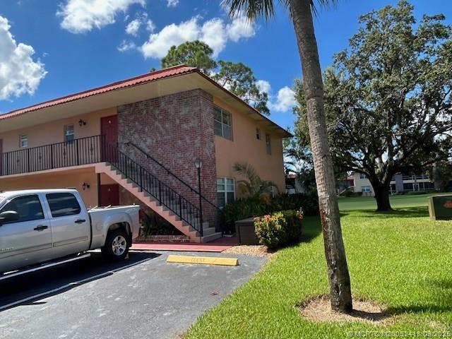 a view of a car park in front of a house