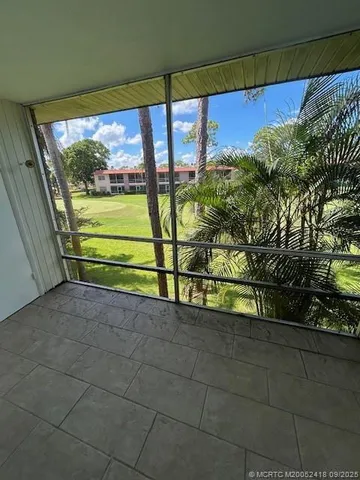 a view of a street with an outdoor seating