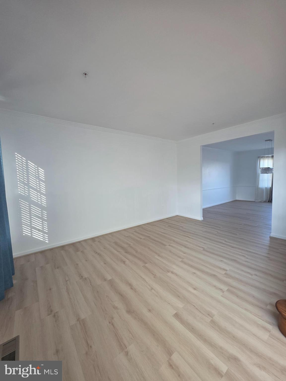 2409 Barrett Court Frederick, MD 21702 - Photo 9 of 19 a view of empty room with wooden floor