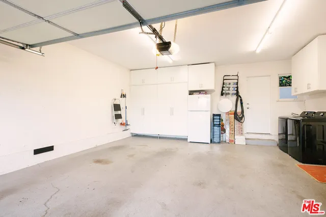 a view of a storage & utility room with stairs