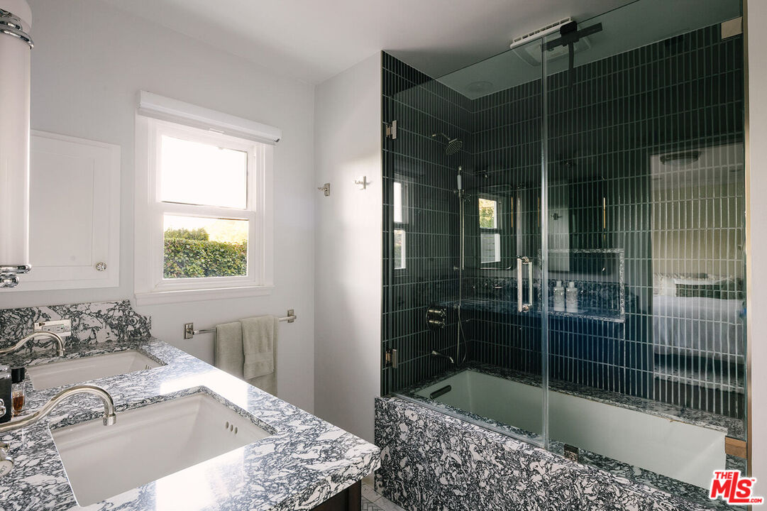 3346 Coy Drive Sherman Oaks, CA 91423 - Photo 22 of 41 a bathroom with a shower and a sink