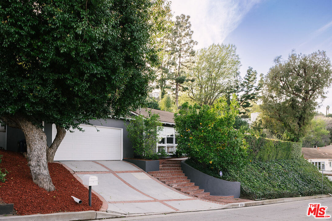 3346 Coy Drive Sherman Oaks, CA 91423 - Photo 37 of 41 a front view of a house with trees