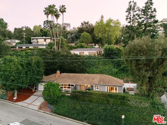 a view of house with outdoor space and garden