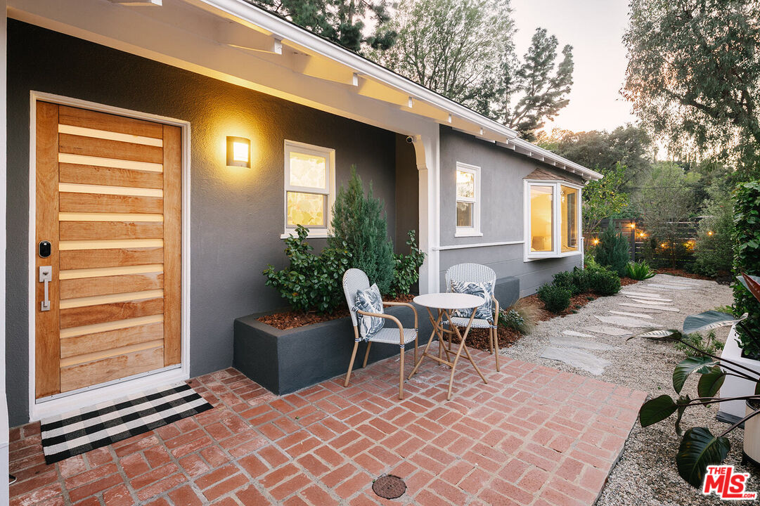 3346 Coy Drive Sherman Oaks, CA 91423 - Photo 4 of 41 a backyard of a house with yard and outdoor seating