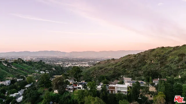 a view of a city with mountain