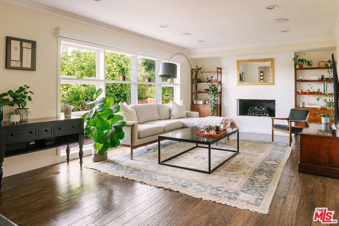 3346 Coy Drive Sherman Oaks, CA 91423 - Photo 8 of 41 a living room with furniture and a fireplace