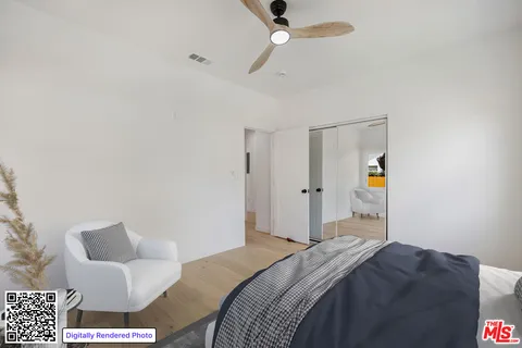 a bedroom with a bed and a couch