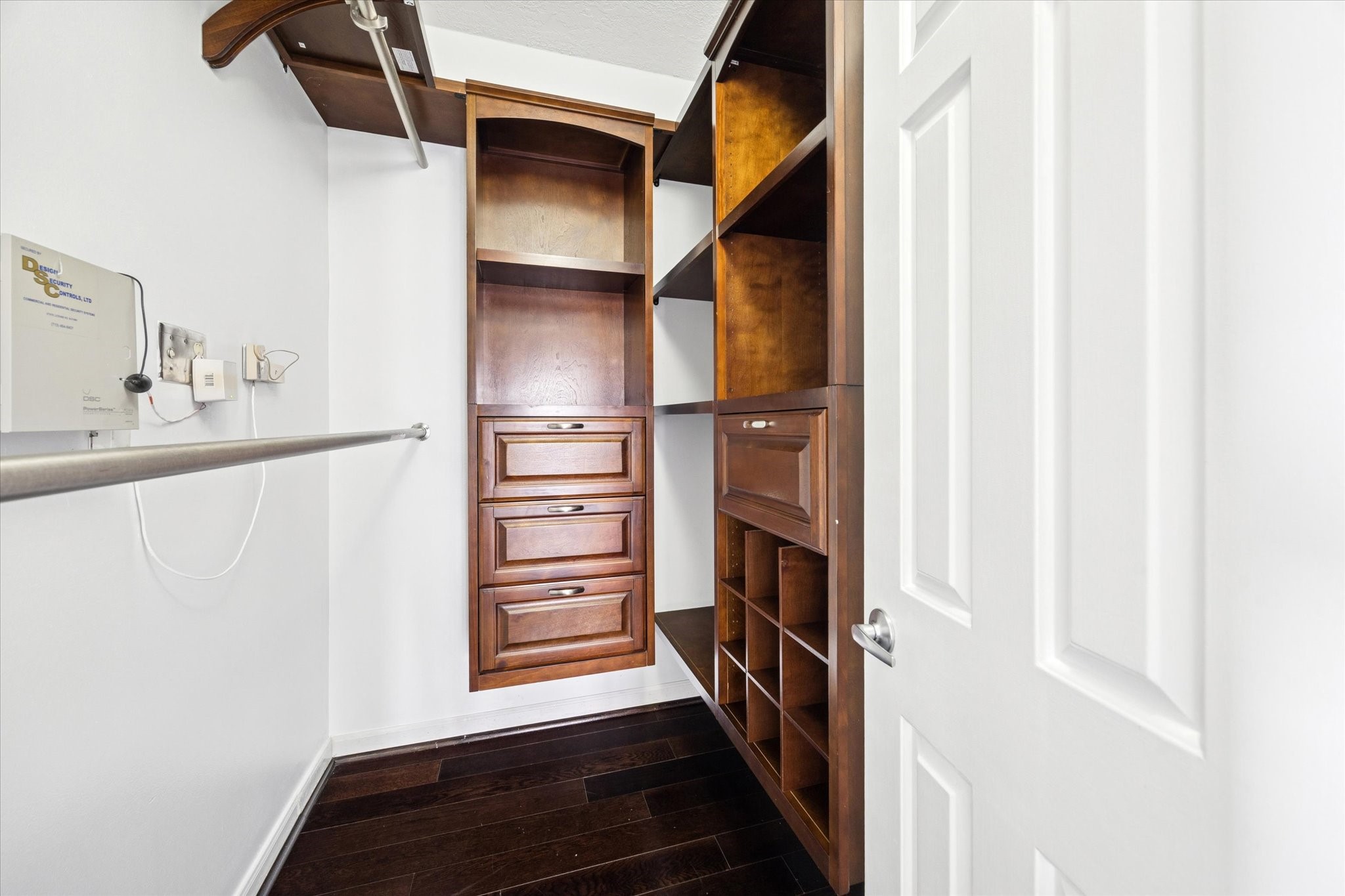3350 McCue Road, Unit 2201 Houston, TX 77056 - Photo 13 of 27 PRIMARY CLOSETS (1 of 2) - Exceptional storage is provided by two walk-in closets in the Primary Bedroom, both featuring high-quality custom built-in shelving, drawers, shoe cubbies and ample clothes hanging space.