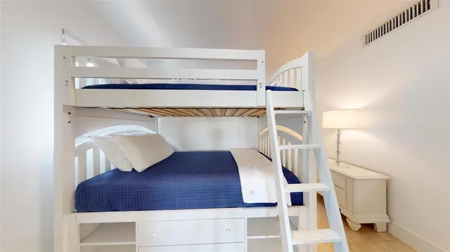 a bedroom with furniture and a couch