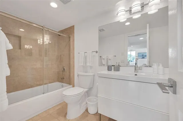 a view of a house with a backyard and a patio