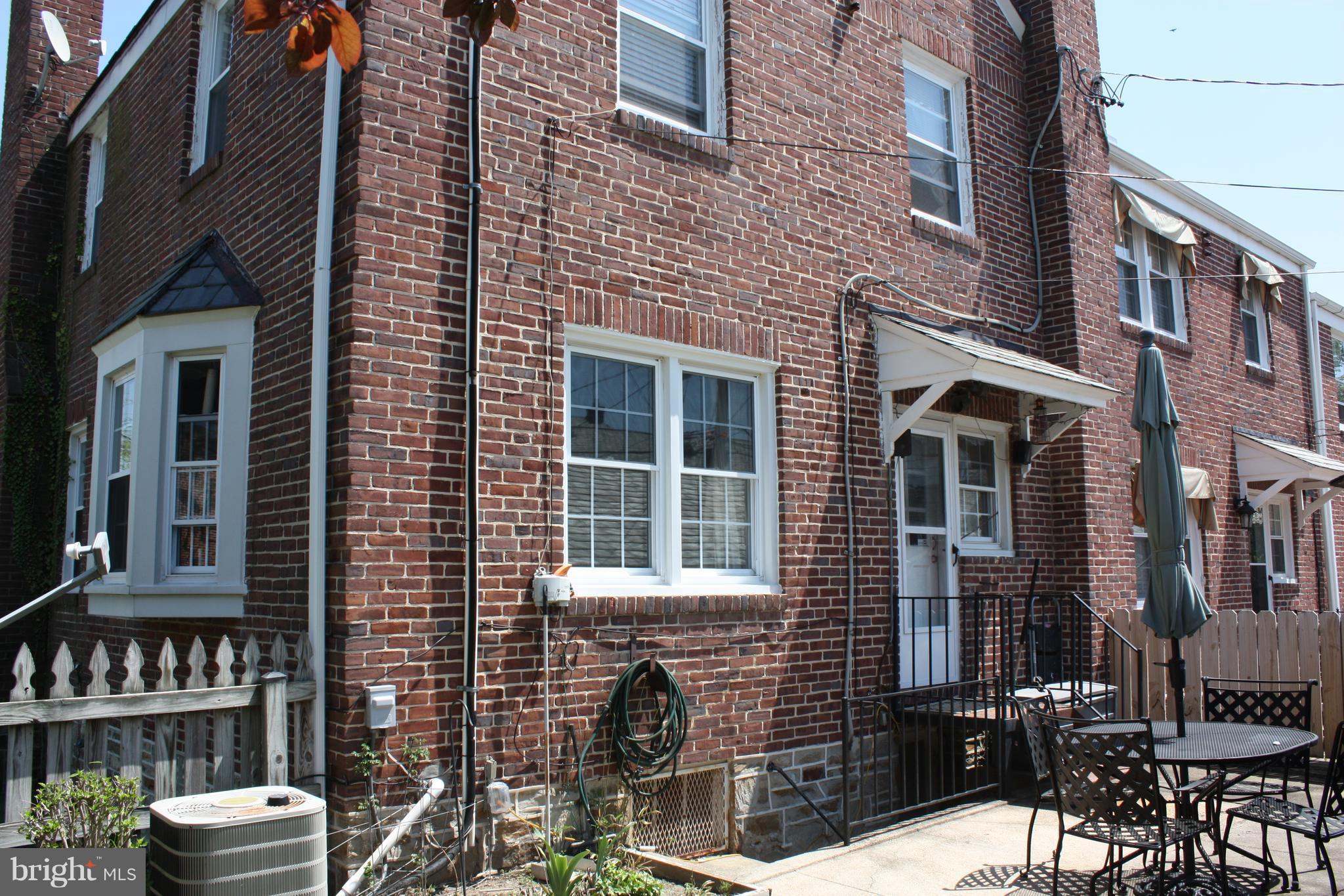 3722 Delverne Road Baltimore, MD 21218 - Photo 26 of 29 a front view of a brick building with many windows